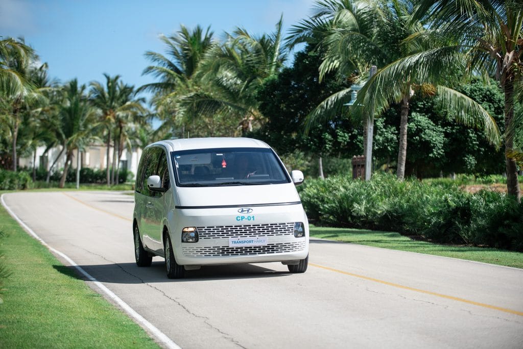 Front view of a white Hyundai Staria of Cana Transfers on a road in Punta Cana
